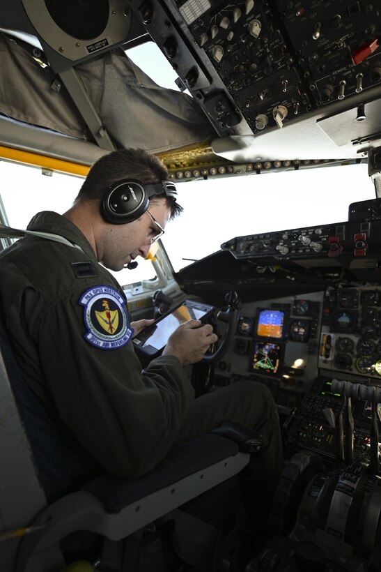 U.S. Air Force Capt. James Huff, 351st Air Refueling Squadron pilot, looks at his flight path during exercise High Life over the North Sea, Sept. 15, 2021. Agility, deterrence, and resiliency are essential to defense and operational capability in a contested environment. (U.S. Air Force photo by Senior Airman Joseph Barron)