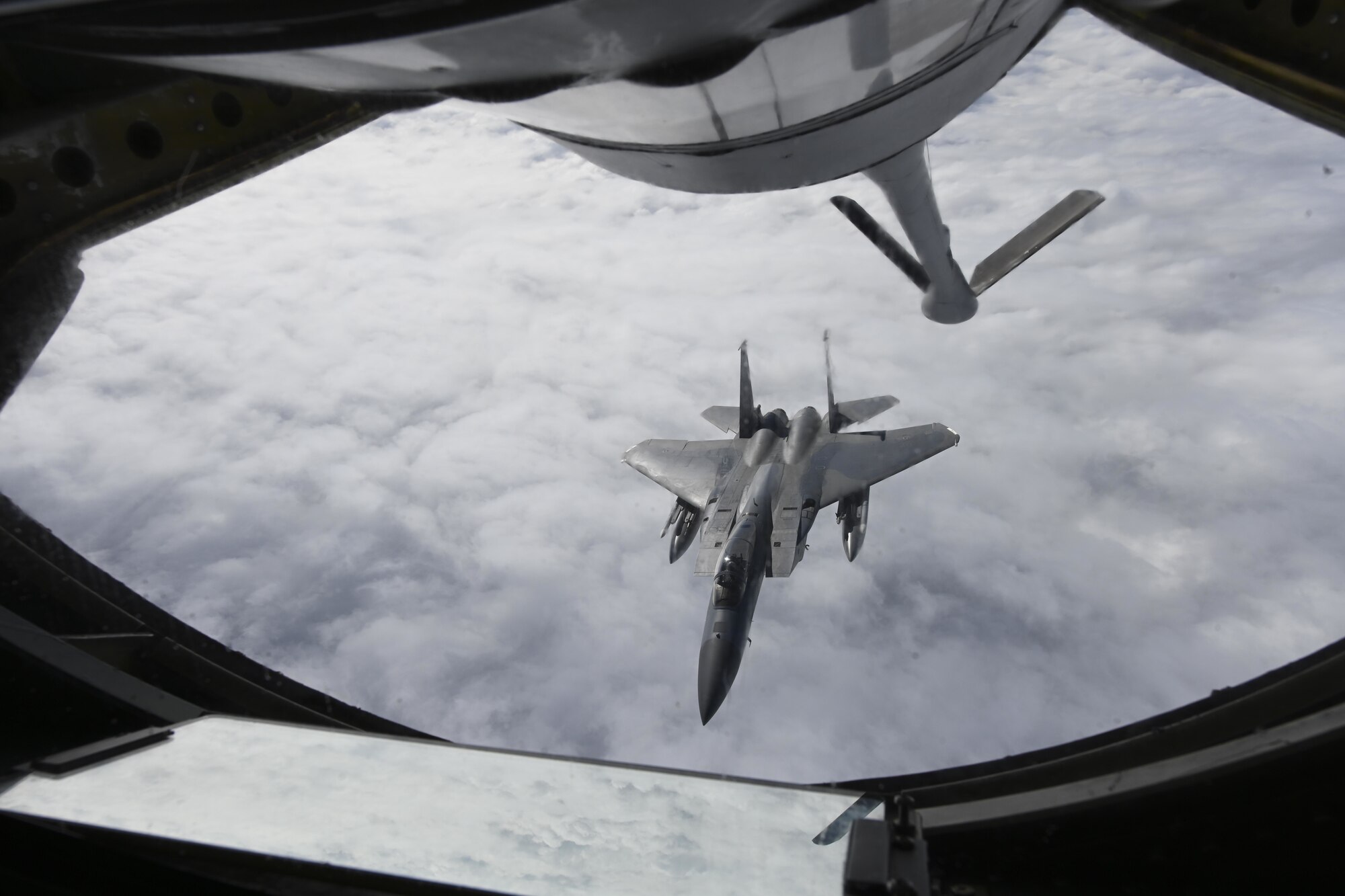 A U.S. Air Force F-15C Eagle aircraft assigned to the 48th Fighter Wing, Royal Air Force Lakenheath, England, departs after receiving fuel from a KC-135 Stratotanker aircraft assigned to the 100th Air Refueling Wing, RAF Mildenhall, England, during exercise High Life over the North Sea, Sept. 15, 2021. Training with joint and combined allies and partners during ACE events increases lethality and enhances interoperability, allowing U.S. forces to counter military aggression and coercion by sharing responsibilities for common defense. (U.S. Air Force photo by Senior Airman Joseph Barron)