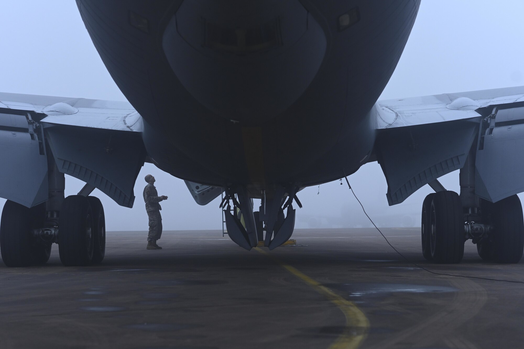 A U.S. Airman assigned to the 100th Air Refueling Wing listens to instructions from an aircrew member before boarding a KC-135 Stratotanker aircraft during exercise High Life at Royal Air Force Fairford, England, Sept. 16, 2021. U.S. agility, deterrence, and resiliency are essential to defense and operational capability in a contested environment. (U.S. Air Force photo by Senior Airman Joseph Barron)