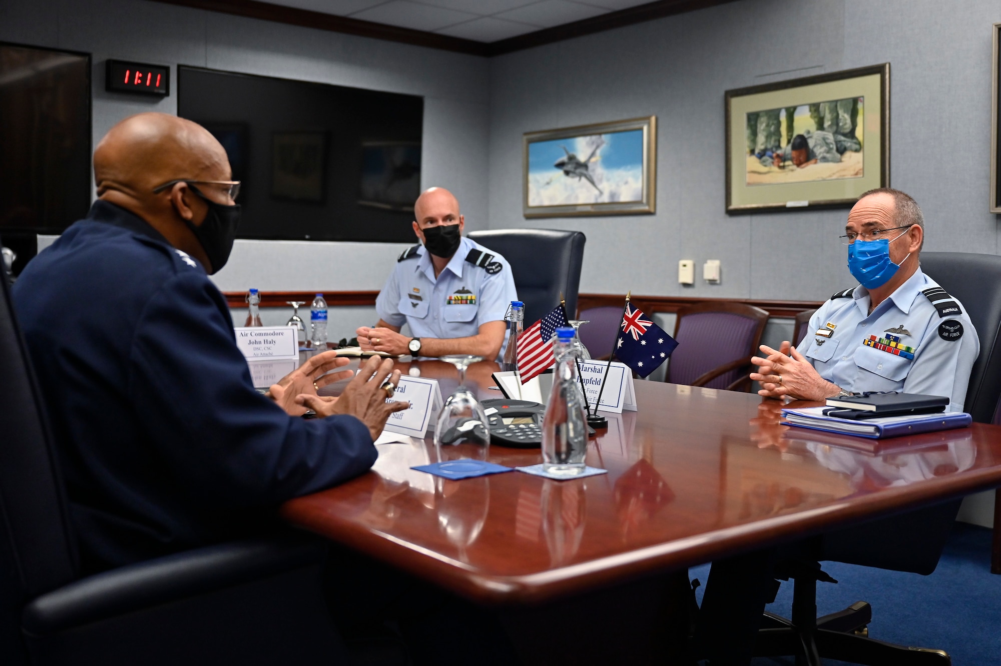 Air Marshal Melvin Hupfeld, right, chief of the Australian air force, speaks with Air Force Chief of Staff Gen. CQ Brown, Jr. during a meeting