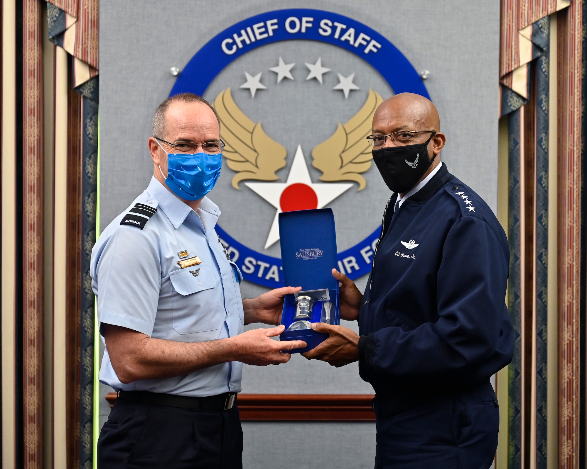 Air Force Chief of Staff Gen. CQ Brown, Jr., right, poses with Air Marshal Melvin Hupfeld