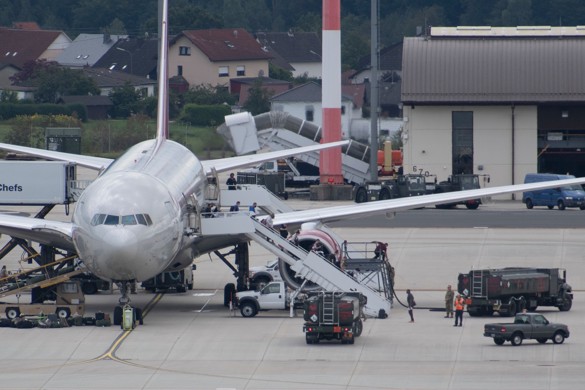 Passengers disembark from a Patriot Express commercial airline at Spangdahlem Air Base, Germany, Aug. 23, 2021.