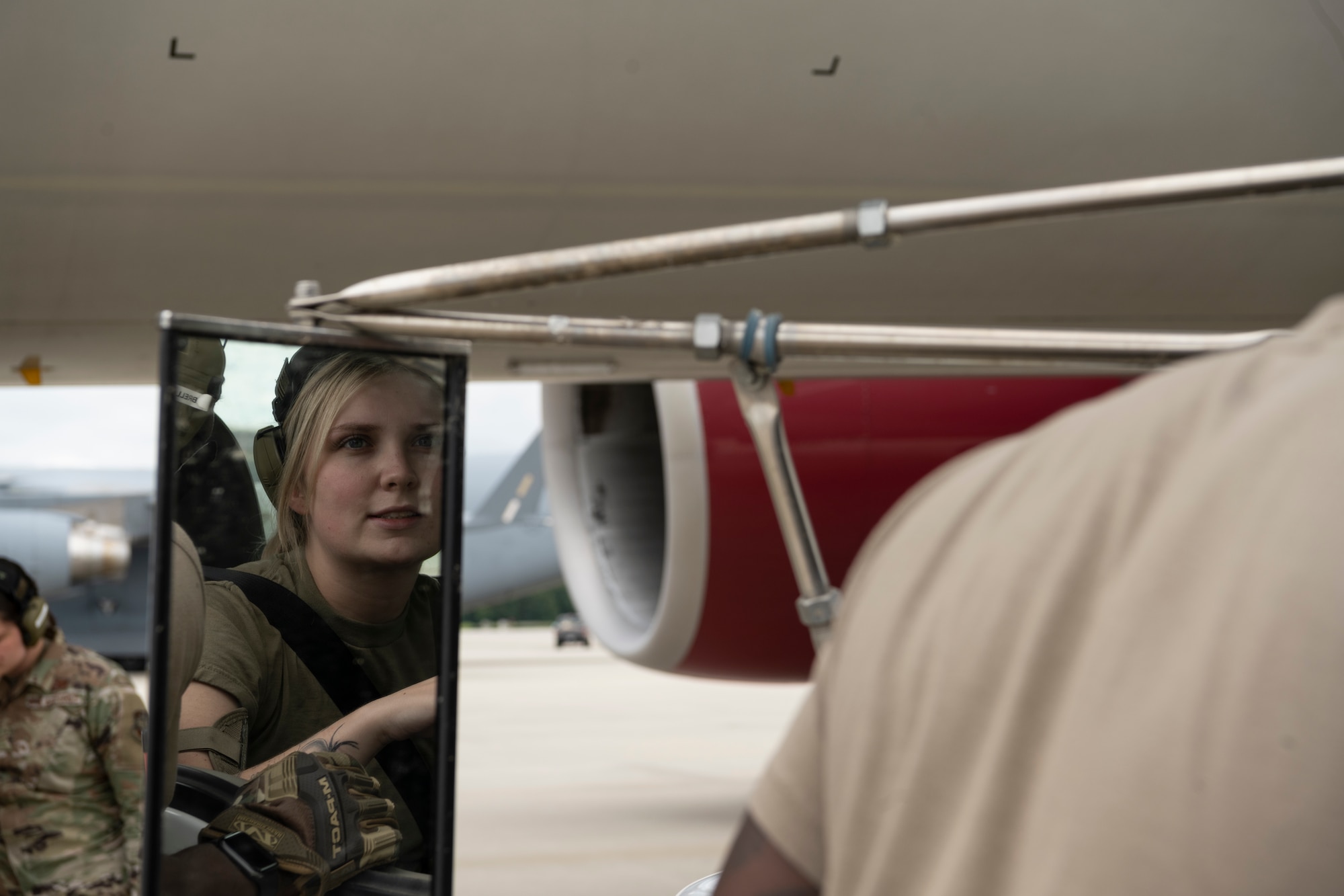 U.S. Air Force Airman 1st Class Erin Billings, 726th Air Mobility Squadron passenger service agent, drives a stair truck to offload passengers from a Patriot Express passenger jet on Spangdahlem Air Base, Germany, Aug. 23, 2021.