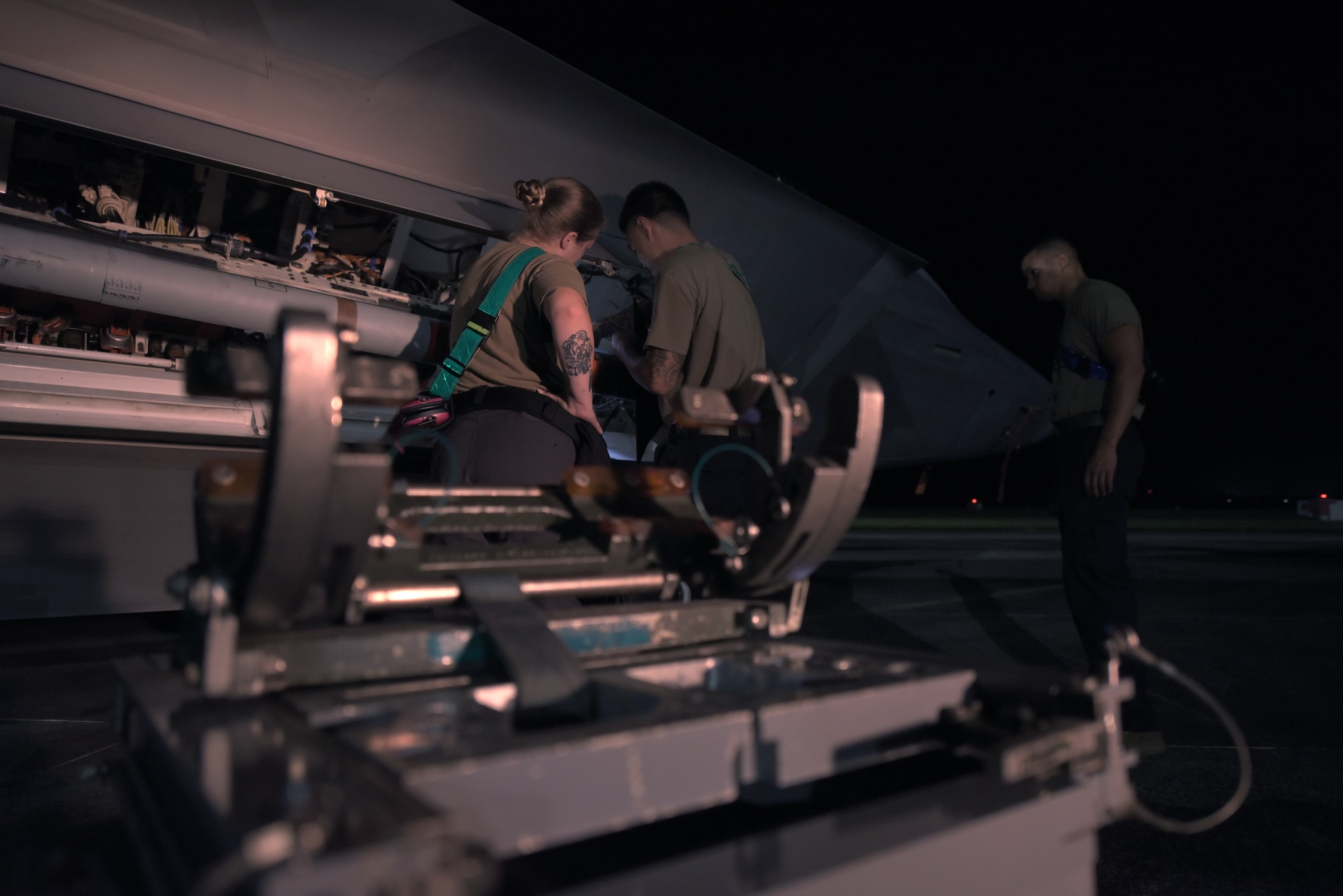 Airmen working on a plane