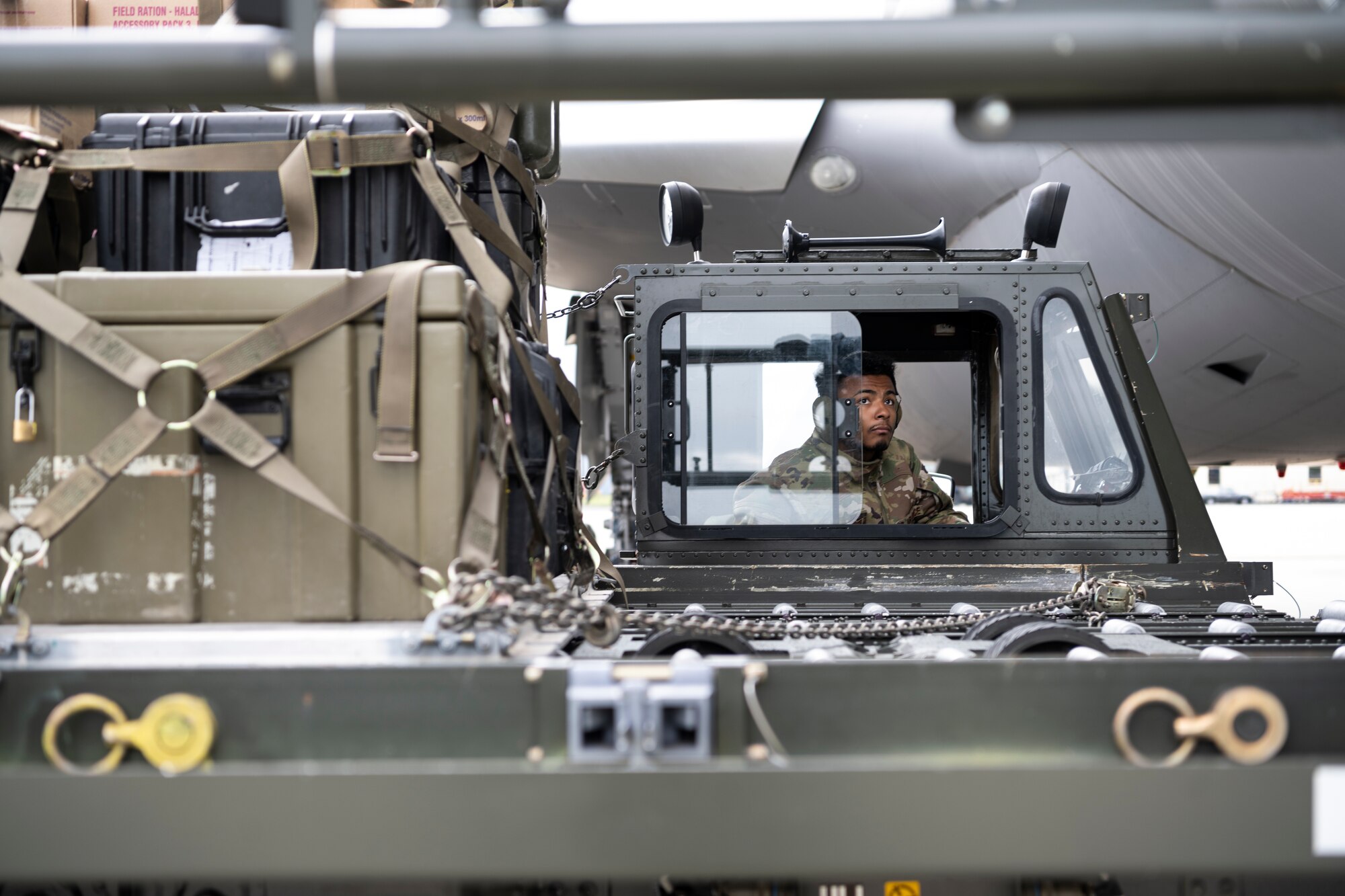 U.S. Air Force Staff Sgt. Jordan Gilchrist, 726th Air Mobility Squadron aircraft services supervisor, uses a Tunner 60K aircraft cargo loader to load cargo onto a Republic of Singapore Air Force A330 Multi-Role Tanker Transport aircraft on Spangdahlem Air Base, Germany, Aug. 30, 2021.