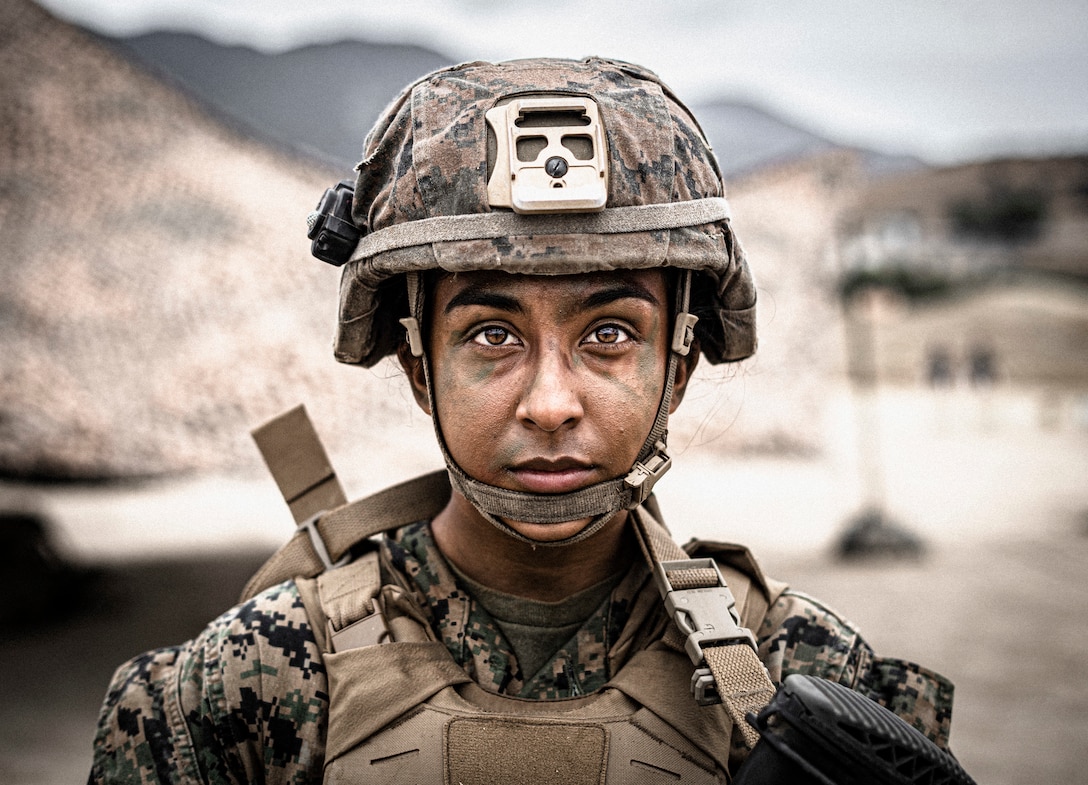 U.S. Marine Pfc. Emily Zamudio with Alpha Company, Infantry Training Battalion, School of Infantry (SOI) West, prepares for a shooting drill at Marine Corps Base Camp Pendleton on Sept. 1, 2021. Zamudio graduated recruit training from the first female platoon to become Marines at Marine Corps Recruit Depot San Diego, May 2021. She then progressed to SOI West where she completed the Infantry Marine Course and earned the military occupational specialty of 0311, infantry Marine. (U.S. Marine Corps photo by Sgt. Tessa D. Watts)