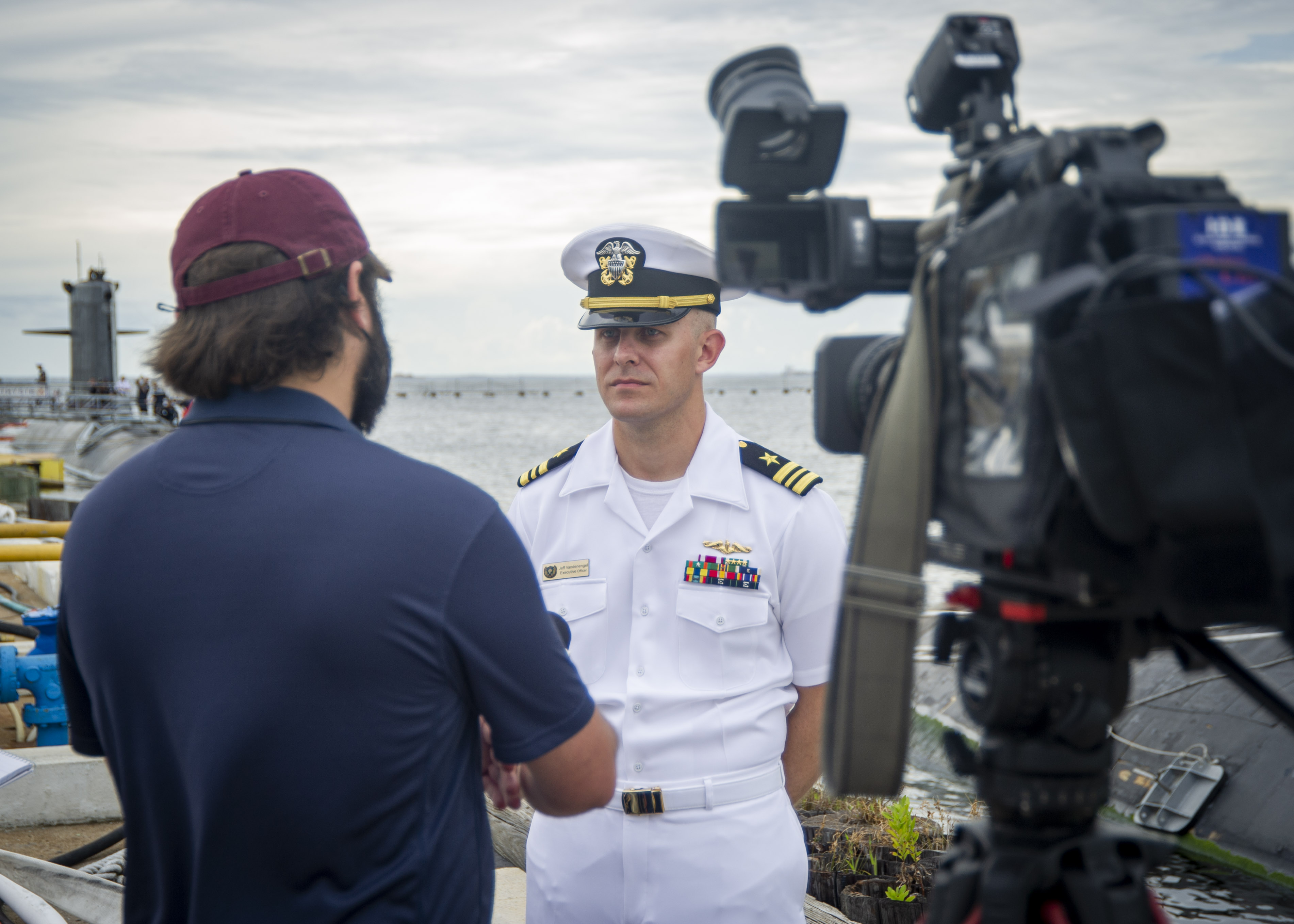 Lt. Cmdr. Jeff Vandenengel, executive officer of the Virginia-class fast-attack submarine USS John Warner (SSN 785), conducts a media interview after the arrival of the French submarine FNS Améthyste (S605) at Naval Station Norfolk, Sept. 16, 2021