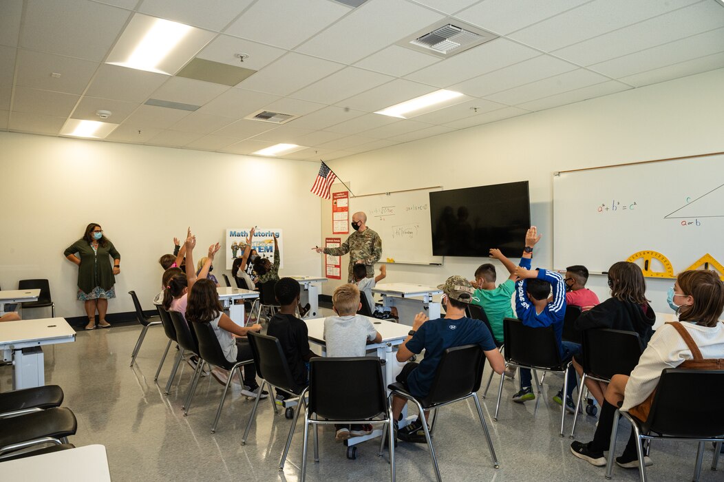 Brig. Gen. Matthew Higer, 412th Test Wing Commander, fields questions from 5th graders at Irving L. Branch Elementary School at the kick-off of the Math Tutoring Club on Edwards Air Force Base, California, Sept. 13. (Air Force photo by Katherine Franco)
