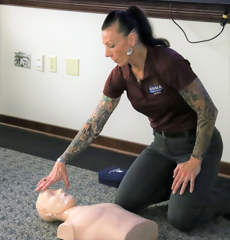IMAGE: Naval Surface Warfare Center Dahlgren Division (NSWCDD) Dam Neck Activity Safety and Environmental Manager Glyndon “G.G.” Murphy instructs a CPR, AED and First Aid training session on Jul. 28 in Virginia Beach, Virginia. Murphy provides the course to military personnel, government employees and Department of Defense contractors who are required to obtain the certification in order to board Navy ships. As the only certified instructor in the command, Murphy travels to NSWCDD regularly to certify personnel there as well.