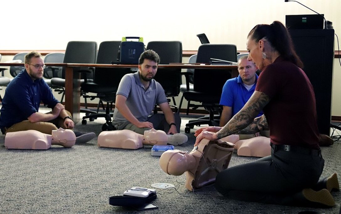 IMAGE: Naval Surface Warfare Center Dahlgren Division (NSWCDD) Dam Neck Activity Safety and Environmental Manager Glyndon “G.G.” Murphy instructs a CPR, AED and First Aid training session on Jul. 28 in Virginia Beach, Virginia. Murphy provides the course to military personnel, government employees and Department of Defense contractors who are required to obtain the certification in order to board Navy ships. As the only certified instructor in the command, Murphy travels to NSWCDD regularly to certify personnel there as well.