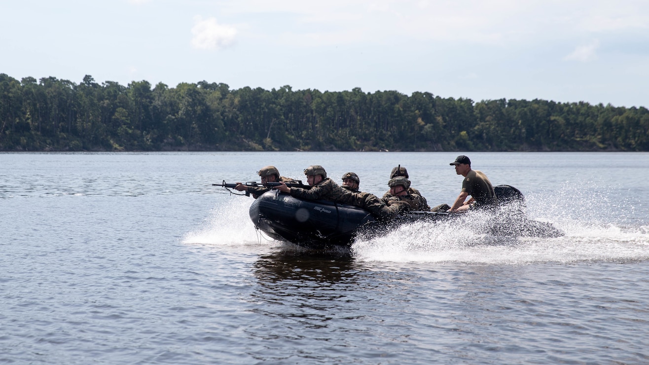U.S. Marines and Sailors with 1st Battalion, 2d Marines, 2d Marine Division, ride a Zodiac combat rubber raiding craft during training on Camp Lejeune, N.C., Sept. 15, 2021. Marines with 1/2 and 2d Reconnaissance Battalion, 2d Marine Division, worked together to conduct small boat familiarization and training to facilitate littoral maneuvers and distributed operations. (U.S. Marine Corps photo by Lance Cpl. Jennifer E. Reyes)
