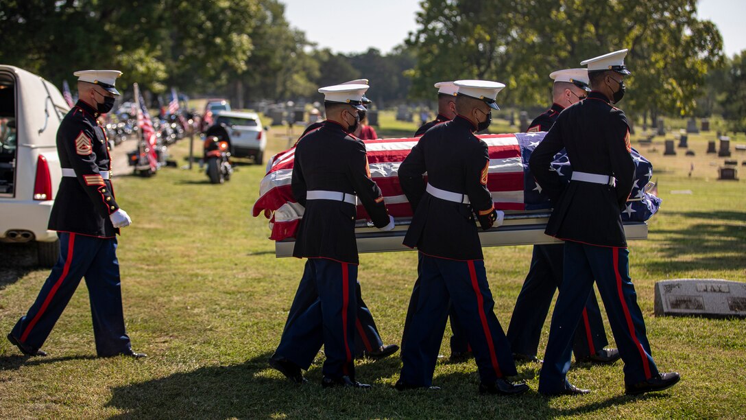 U.S. Marines with Combat Logistics Battalion 453, 4th Marine Logistics Group, transport a casket during the funeral of Pfc. Glenn White in Emporia, Kan., Sept. 18, 2021. In November 1943, White was a member of 1st Battalion, 6th Marine Regiment, 2d Marine Division, when he was killed in action in the Tarawa Atoll of the Gilbert Islands during War World II. (U.S. Marine Corps photo by Lance Cpl. Jacqueline C. Arre)