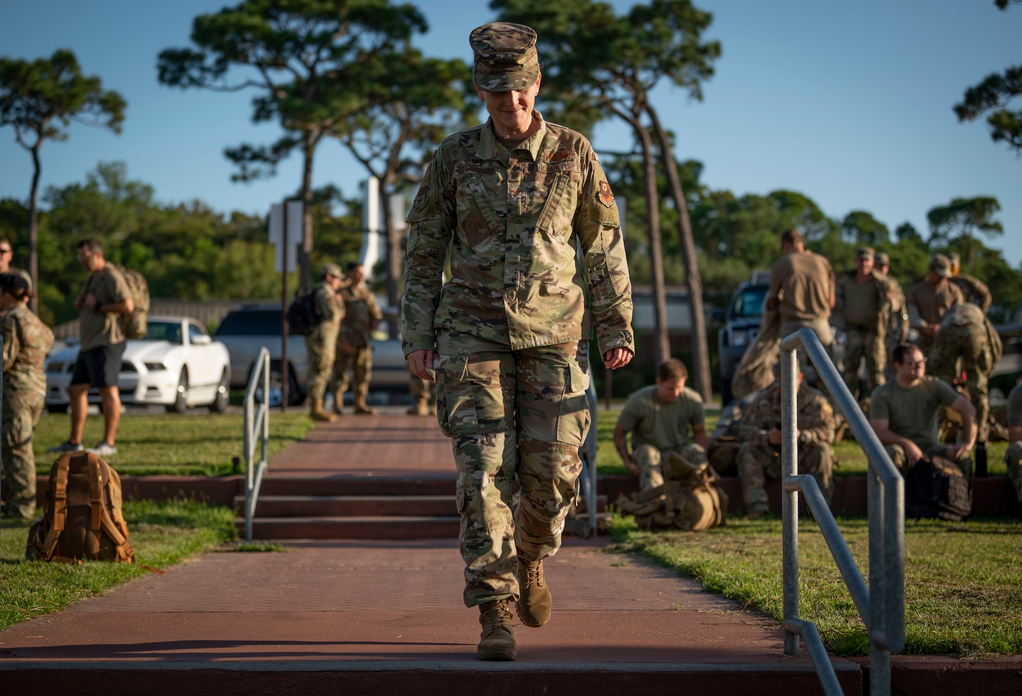 U.S. Air Force Col. Jocelyn Schermerhorn, 1st Special Operations Wing commander, heads to the front of a crowd of Airmen to start a 9/11 Memorial Ruck Ceremony