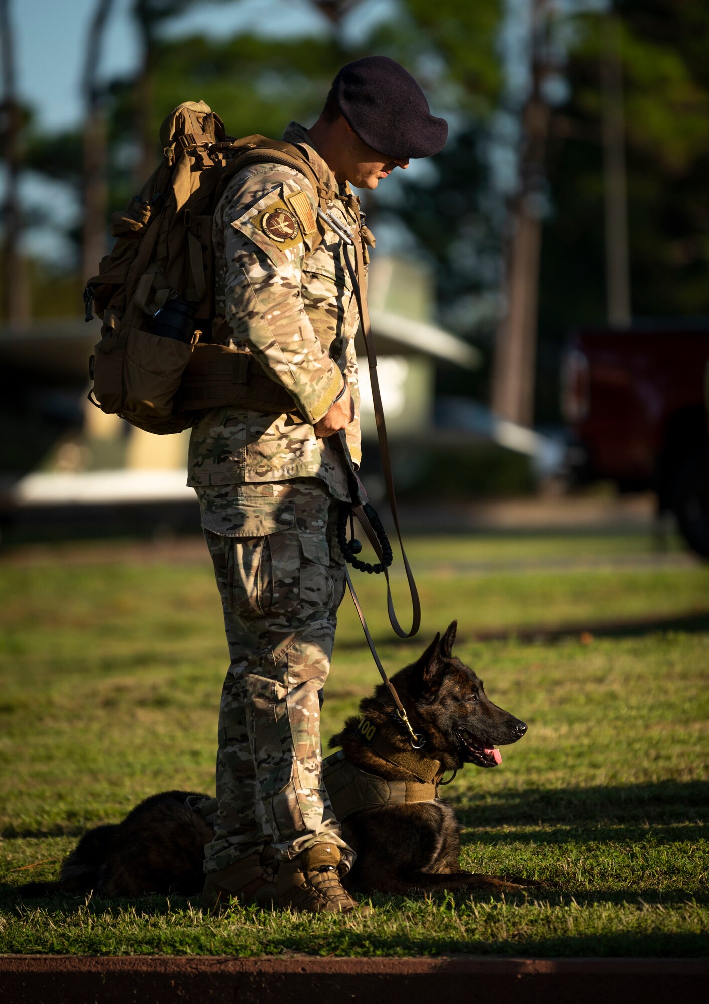 A 1st Special Operations Security Forces Squadron military working dog handler waits for a 9/11 Memorial Ruck Ceremony to begin