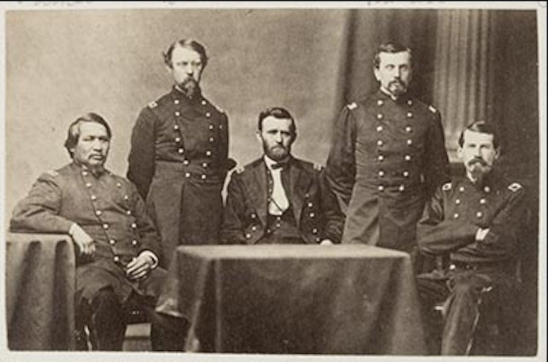 Soldiers pose for a photo.