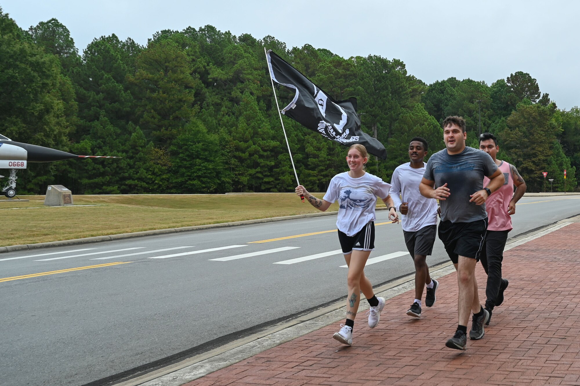 People run with a flag