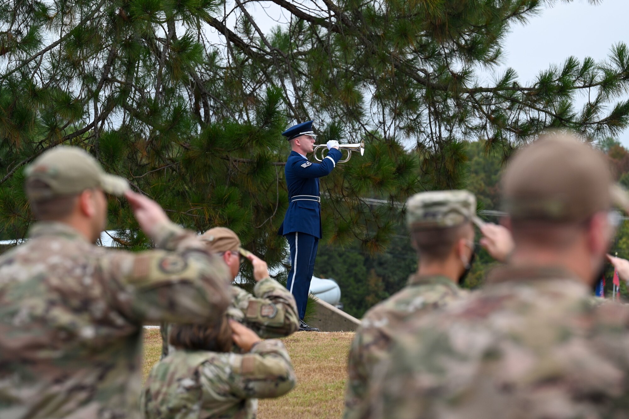 A honor guardsman plays an instrument