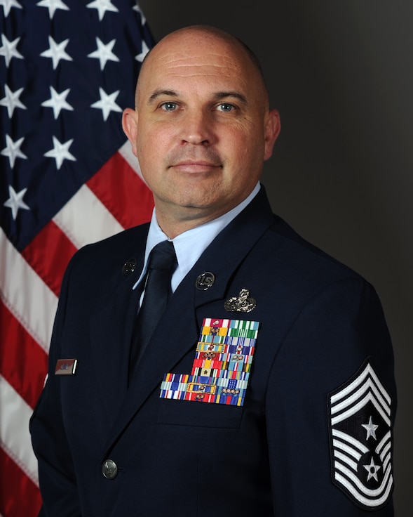 Male Airman in U.S. Air Force blues uniform.