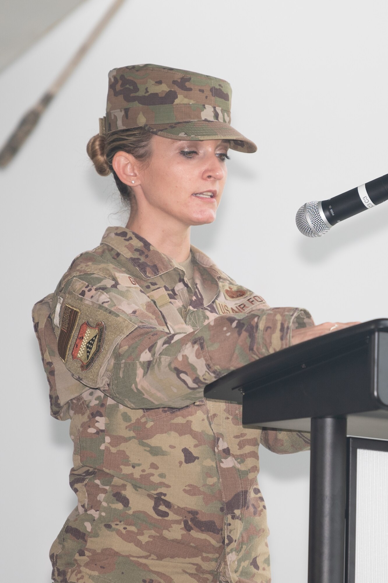 Tech. Sgt. Naomi Goodwin, Air Force Mortuary Affairs Operations dress and restoration section lead, reads a list of  repatriated service members during a retreat ceremony commemorating National POW/MIA Recognition Day on Dover Air Force Base, Delaware, Sept. 17, 2021. Members of AFMAO and the Air Force Medical Examiner System DNA Operations Department read the names of 138 service members who were repatriated this year. (U.S. Air Force photo by Mauricio Campino)