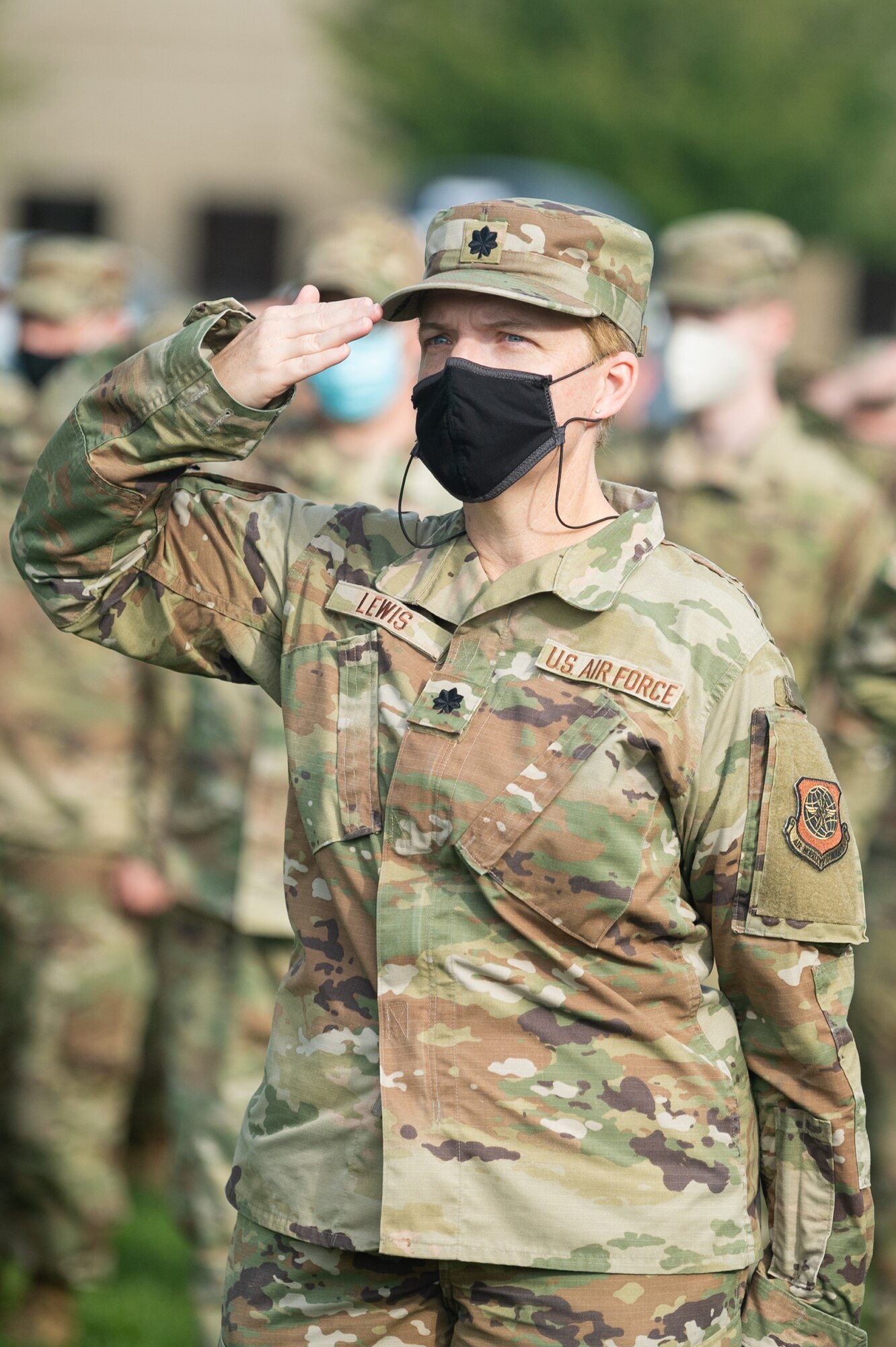 Lt. Col. Gretchen Lewis, 436th Comptroller Squadron commander, salutes during a retreat ceremony commemorating National POW/MIA Recognition Day on Dover Air Force Base, Delaware, Sept. 17, 2021. During the ceremony, members of the Dover AFB Honor Guard played taps, fired a volley salute and performed a flag folding. (U.S. Air Force photo by Mauricio Campino)