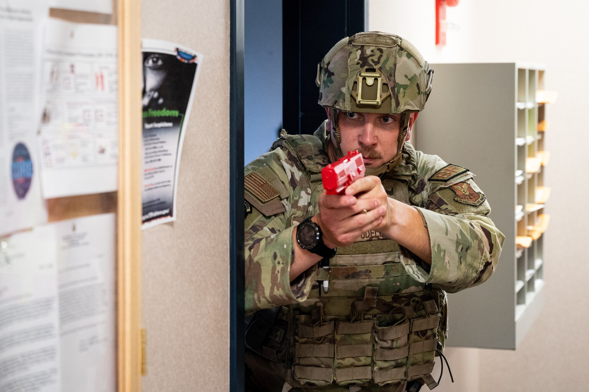 Tech. Sgt. Jacob Udell, 2nd Security Forces Squadron flight sergeant, stands guard at the entrance of a room during an active shooter exercise at Barksdale Air Force Base, Louisiana, Sept. 16, 2021. The 2nd SFS Airmen are the first to respond to an active shooter and they're tasked with neutralizing the threat and protecting base personnel. (U.S. Air Force photo by Airman 1st Class Jonathan E. Ramos)