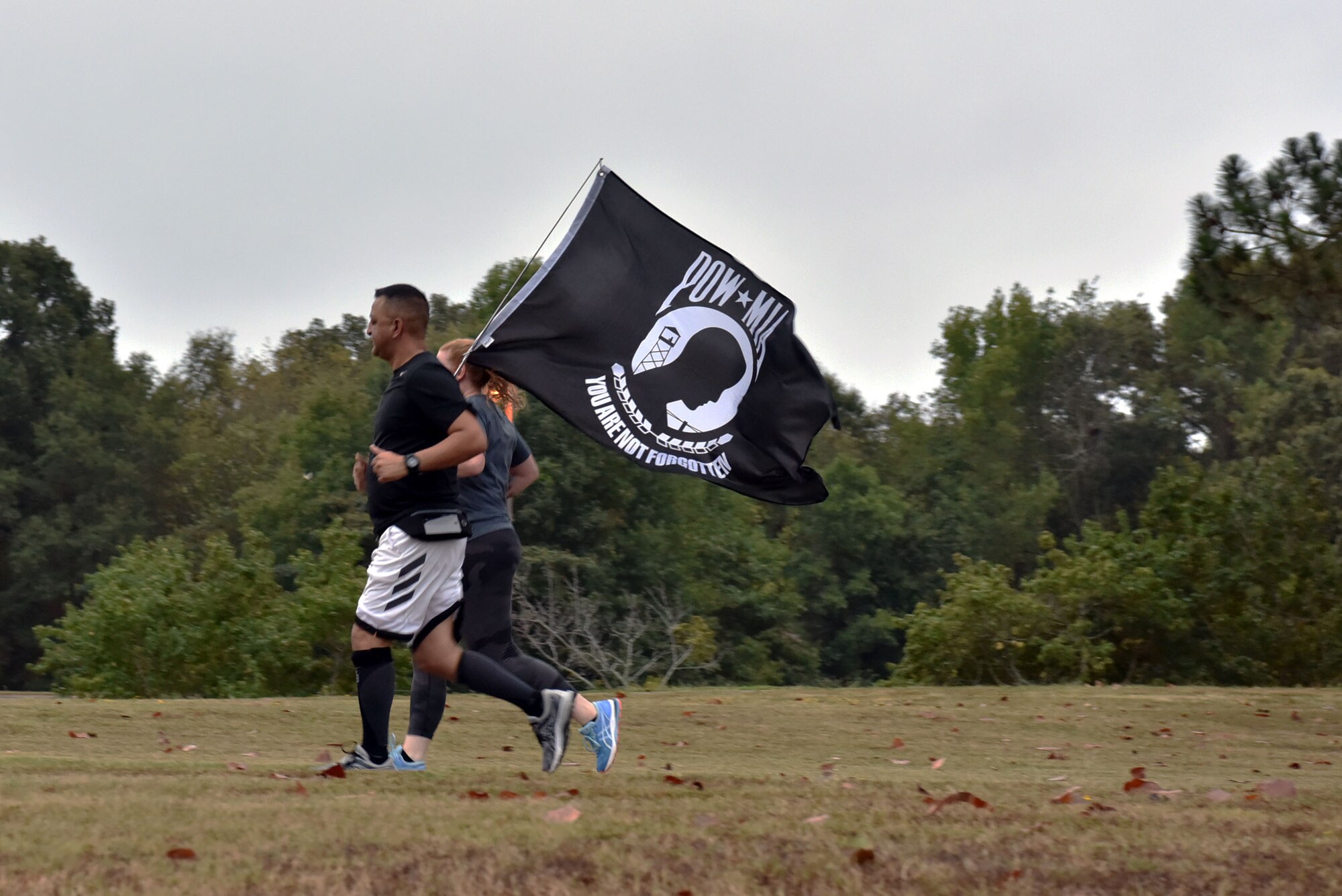 People run with a flag