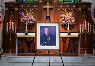 ANNAPOLIS, Md. (Sept. 20, 2021) A photo of the 23rd Chief of Naval Operations (CNO), Adm. Carlisle Trost, is displayed at a memorial service in his honor at the U.S. Naval Academy. Trost was the CNO from 1986 to 1990. (U.S. Navy photo by Mass Communication Specialist 1st Class Sean Castellano/Released)