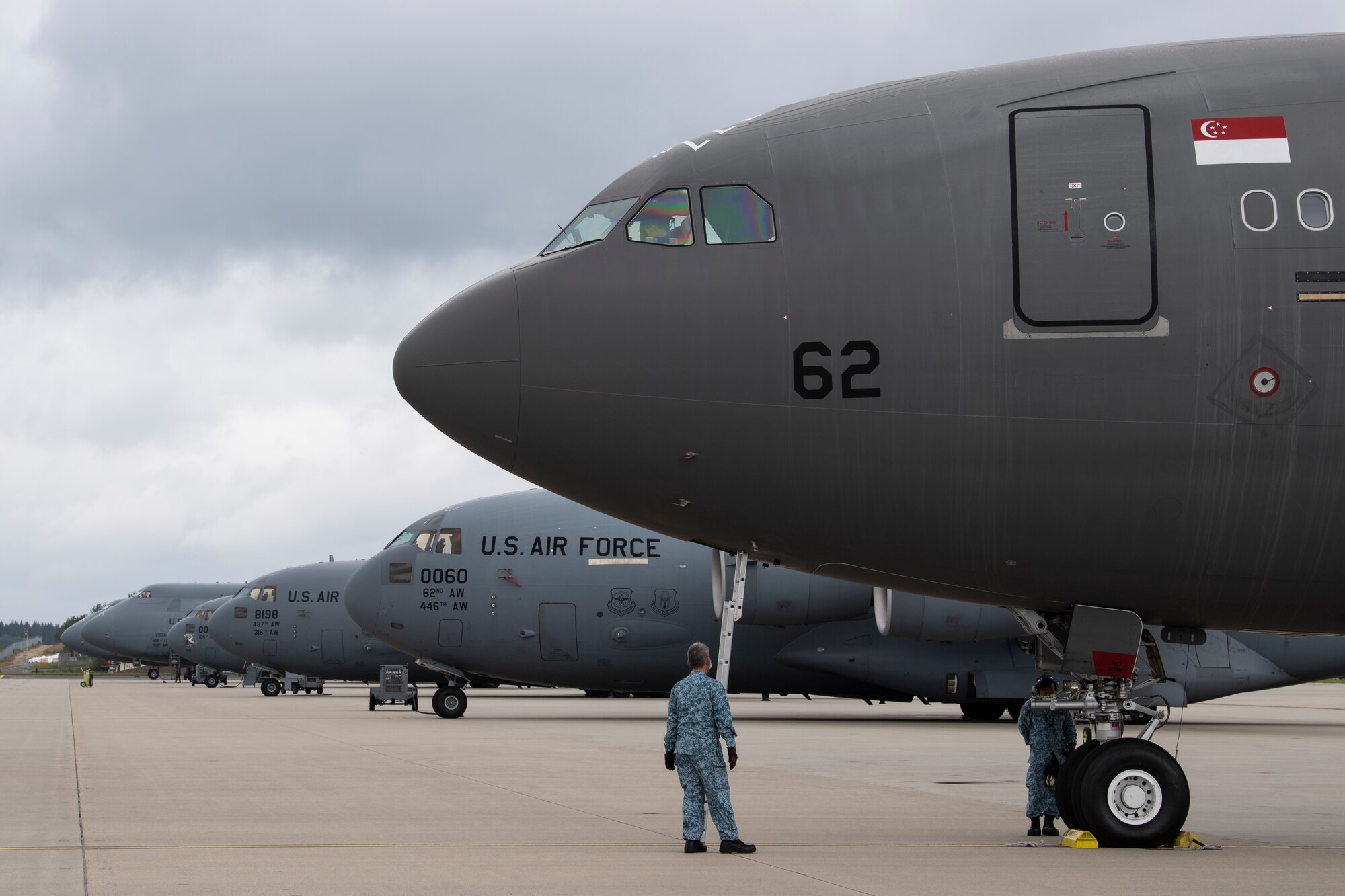 Republic of Singapore Air Force personnel perform pre-flight checks on a RSAF A330 Multi-Role Tanker Transport aircraft.