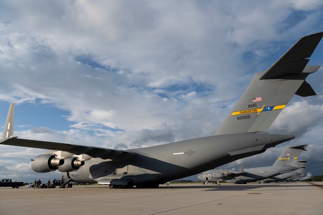 U.S. Air Force crew members board a Joint Base Charleston, South Carolina, C-17 Globemaster III cargo aircraft on Spangdahlem Air Base, Germany, Aug. 27, 2021.