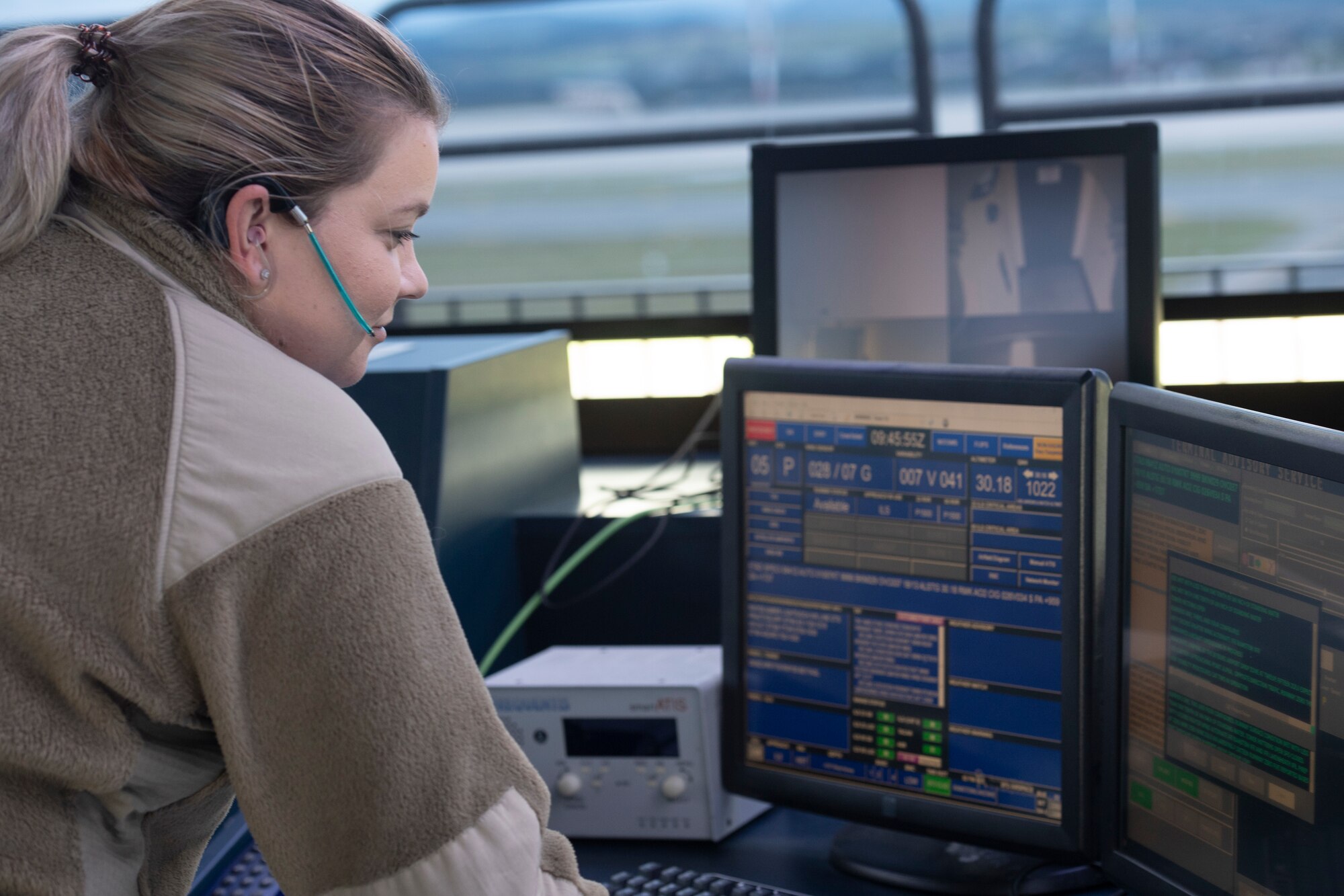 U.S. Air Force Staff Sgt. Kelly Laws, 52nd Operations Support Squadron air traffic control specialist, checks the computer in Spangdahlem Air Base’s air traffic control tower and coordinates air traffic at Spangdahlem Air Base, Germany, Aug. 23, 2021.