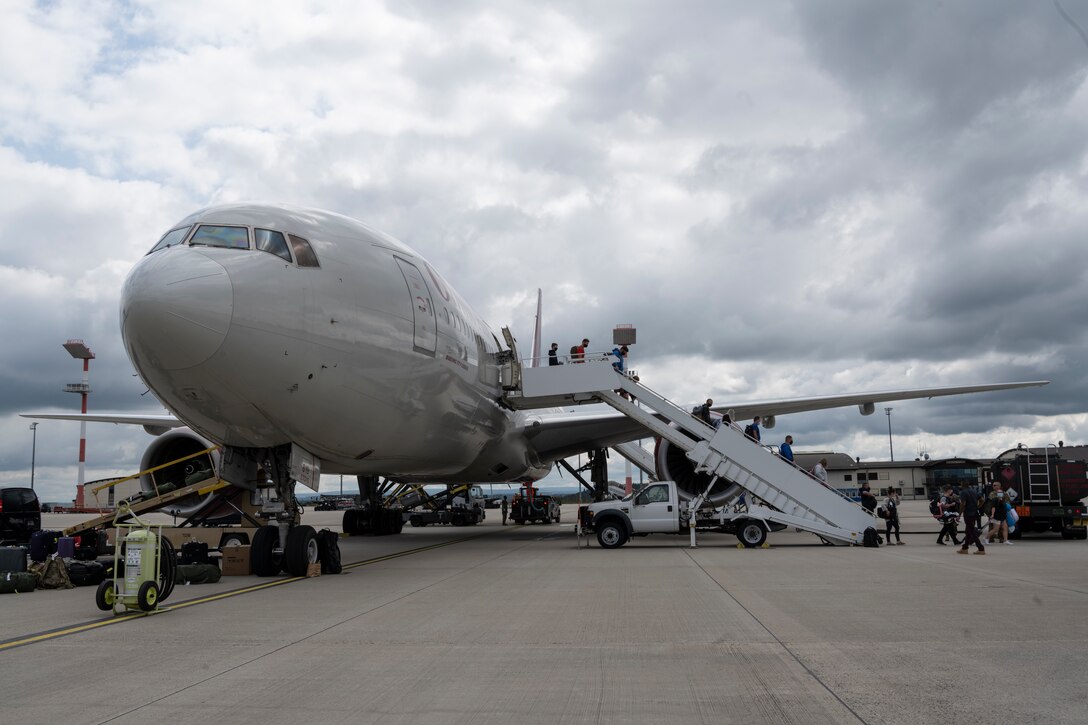 Passengers disembark from a Patriot Express passenger jet on Spangdahlem Air Base, Germany, Aug. 23, 2021.