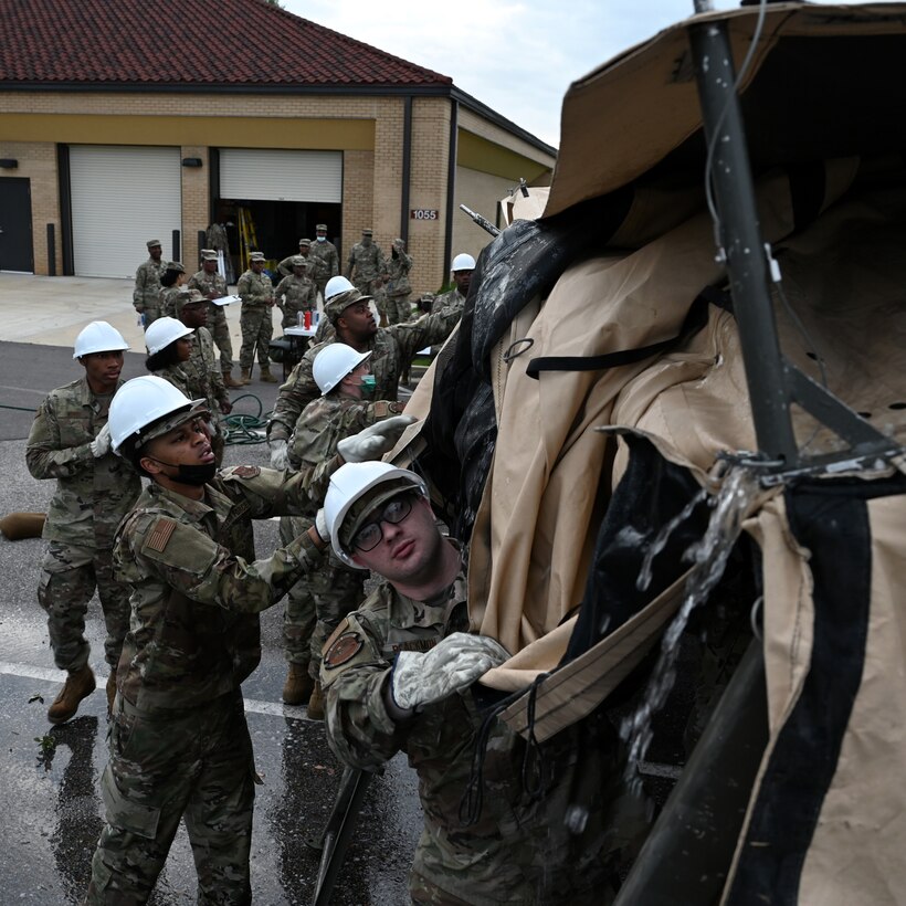 members raise a tent