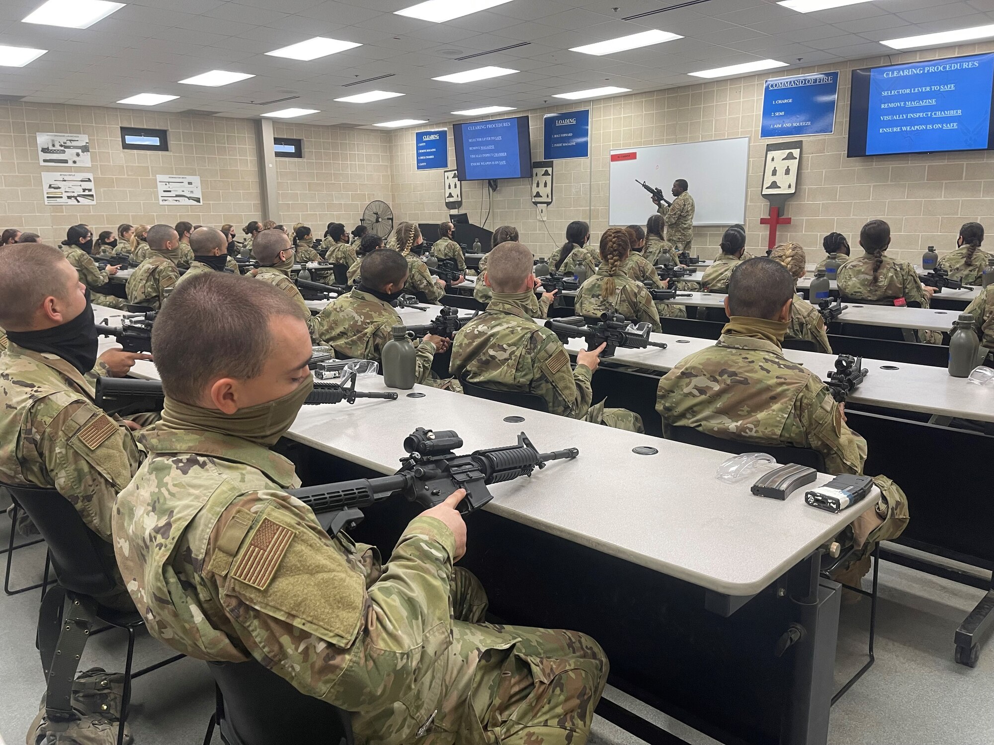 Trainees in CATM classroom learning clearing procedures on M4s