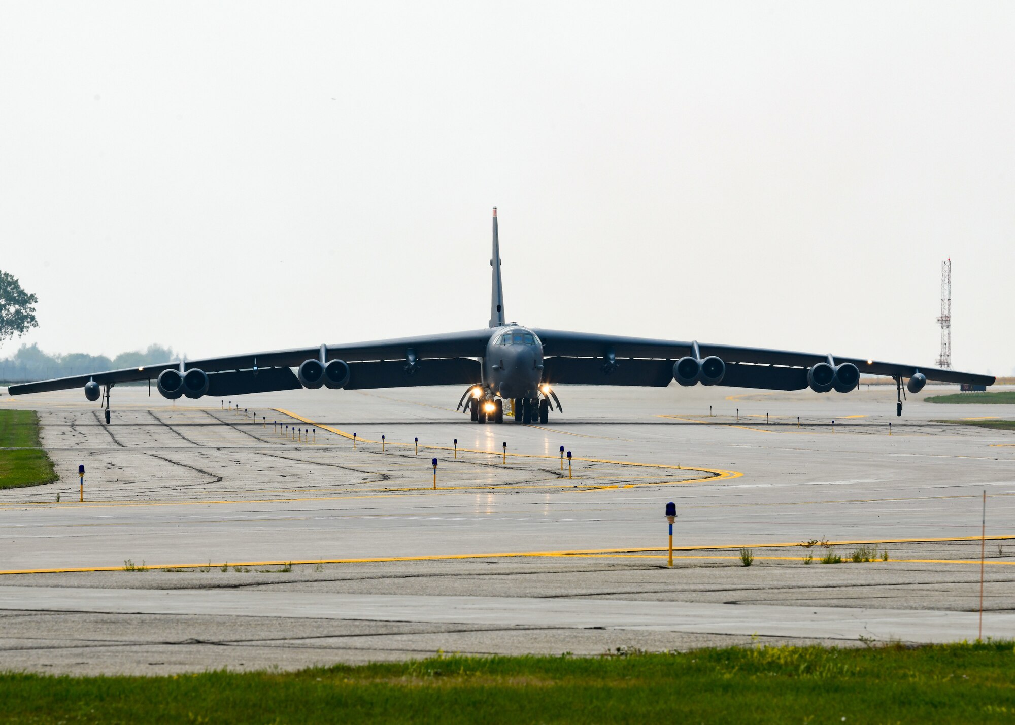 A B-52 taxis on the runway as it returns from Qatar from deployment