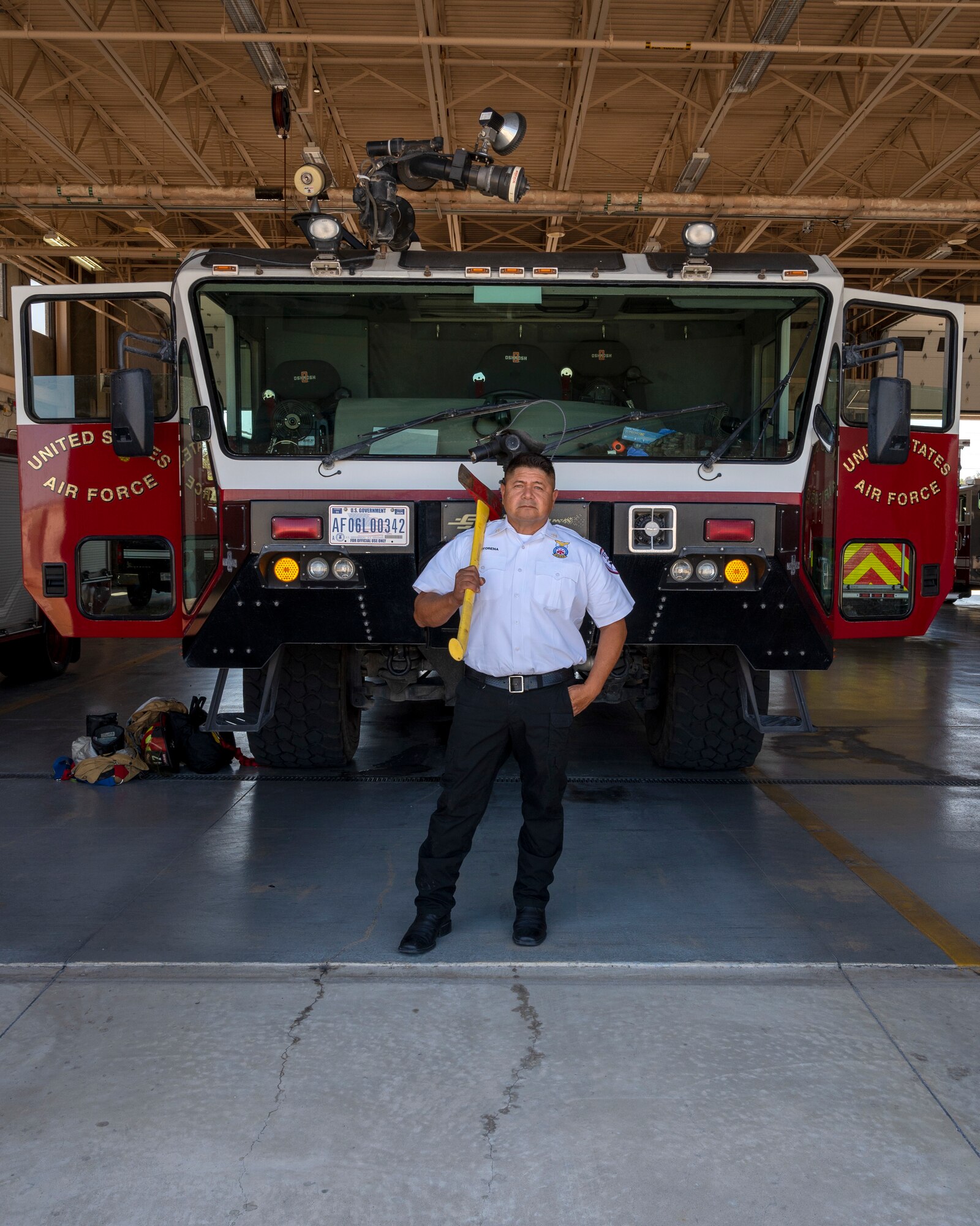 Raul Castorena, 47th Civil Engineering Squadron assistant fire chief, poses in front of a fire engine outside of the Laughlin Air Force Base firestation on September 20, 2021. Mr. Castorena has served as government employee for 30 years and looks out for the men and women under his command. (U.S. Air Force Photo by Senior Airman Nicholas Larsen)