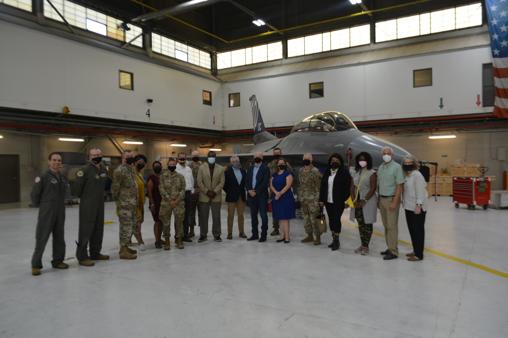 Col. Tyler Schaff, 316th Wing and Joint Base Andrews commander, Col. Michael Oliver, 113th Wing, District of Columbia Air National Guard vice commander, 316th Wing senior leaders, and Joint Base Andrews honorary commanders pose in front of a 121st Fighter Squadron F-16 Fighting Falcon during the Honorary Commanders Program quarterly visit at JBA, Md., Sept. 14, 2021.