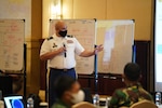 Lt. Col. David Hosea, Hawaii Army National Guard, introduces the center of the gravity assessment step of the operational design process to a team of military planners from the Tentara Nasional Indonesia (TNI) and the Hawaii National Guard during the operational design workshop of Exercise GEMA BHAKTI, September 18, 2012, Jakarta Indonesia.