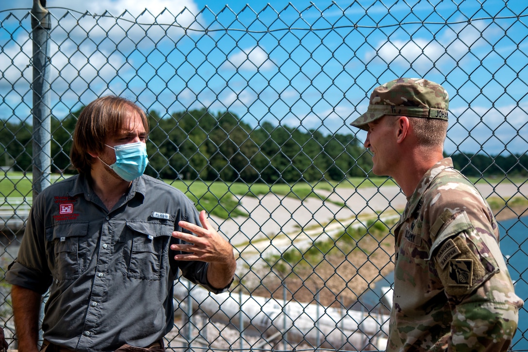 Jesse Helton, a Natural Resources Program Specialist, explains to Lt. Col. Andrew Johannes, commander for the U.S. Army Corps of Engineers Charleston District, how the St. Stephen fish lock operates.  Johannes made his first visit to St. Stephen since taking command of the district in July.
