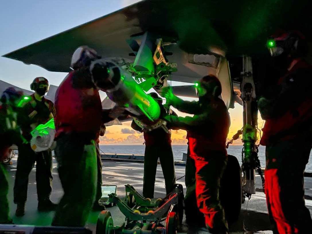 US Marines with Marine Fighter Attack Squadron 211 load a Guided Bomb Unit 49 onto an F-35B Lightning II Joint Strike Fighter in the Western Pacific Ocean on September 12th, 2021. The GBU-49 is a laser and GPS-guided bomb effective across various conditions and against many types of moving or stationary target. VMFA-211, deployed aboard HMS Queen Elizabeth as part of the United Kingdom’s Carrier Strike Group 21, became the first fleet squadron to employ the GBU-49 in a training exercise.