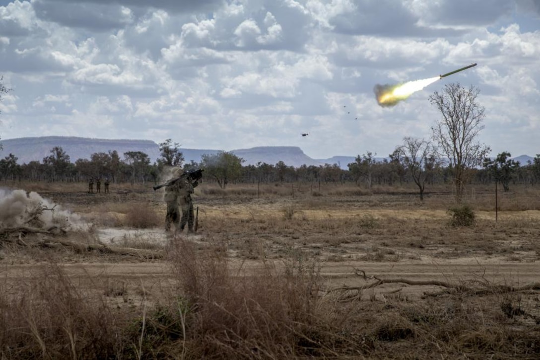 U.S. Marine Corps Lance Cpl. Andrew Morabito, right, a gunner, fires an FIM-92 Stinger missile at a drone with assistant gunner, Sgt. Jason Jones, a squad leader, both with Alpha Battery, 2nd Low Altitude Air Defense Platoon, Marine Medium Tiltrotor Squadron - 363, MRF-D at Bradshaw Field Training Area, NT, Australia, Sep. 3, 2021. The range consisted of Marines and Australian Army soldiers utilizing their respective missile systems to take down notional enemy surveillance drones. The training hones the Marines’ capabilities as a skilled expeditionary fighting force that is capable of responding to a potential crisis or contingency.