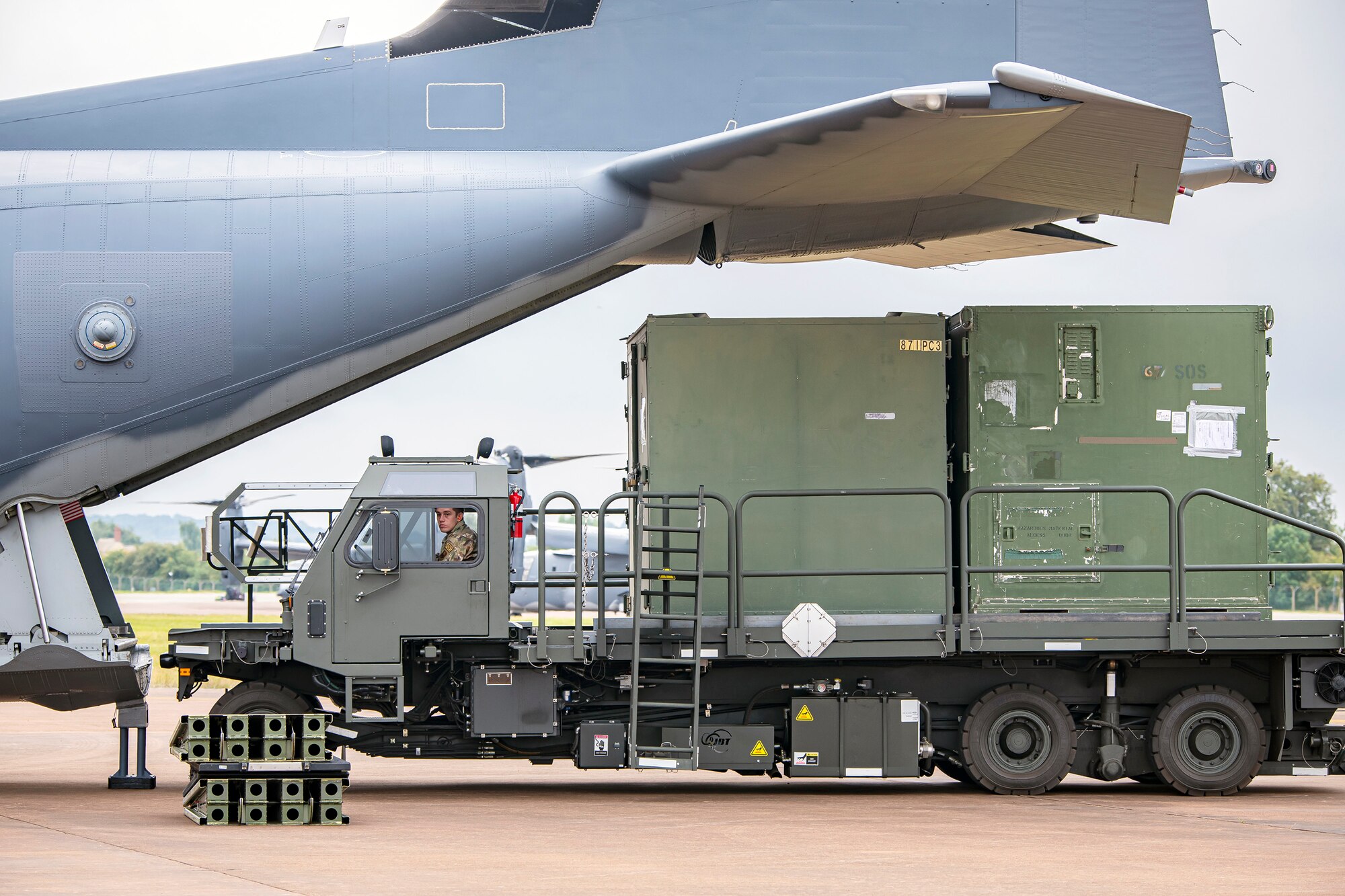 An Airman from the 420th Air Base Group removes cargo from an MC-130J Commando II during an Agile Combat Employment exercise at RAF Fairford, England, Sept. 13, 2021. The exercise enables U.S. forces in Europe to operate from locations with varying levels of capacity and support. This further ensures Airmen and aircrews are postured to deliver lethal combat power across the full spectrum of military operations. (U.S. Air Force photo by Senior Airman Eugene Oliver)