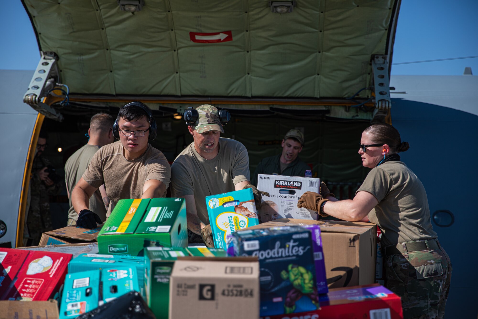 Airmen from Fairchild Air Force Base, Washington, unload donations off a KC-135 Stratotanker in support of Operation Allies Welcome at Holloman Air Force Base, New Mexico, Sept. 17, 2021. The Department of Defense, through U.S. Northern Command, and in support of the Department of State and Department of Homeland Security, is providing transportation, temporary housing, medical screening, and general support for at least 50,000 Afghan evacuees at suitable facilities, in permanent or temporary structures, as quickly as possible. This initiative provides Afghan evacuees essential support at secure locations outside Afghanistan. (U.S. Army photo by Pfc. Anthony Sanchez)