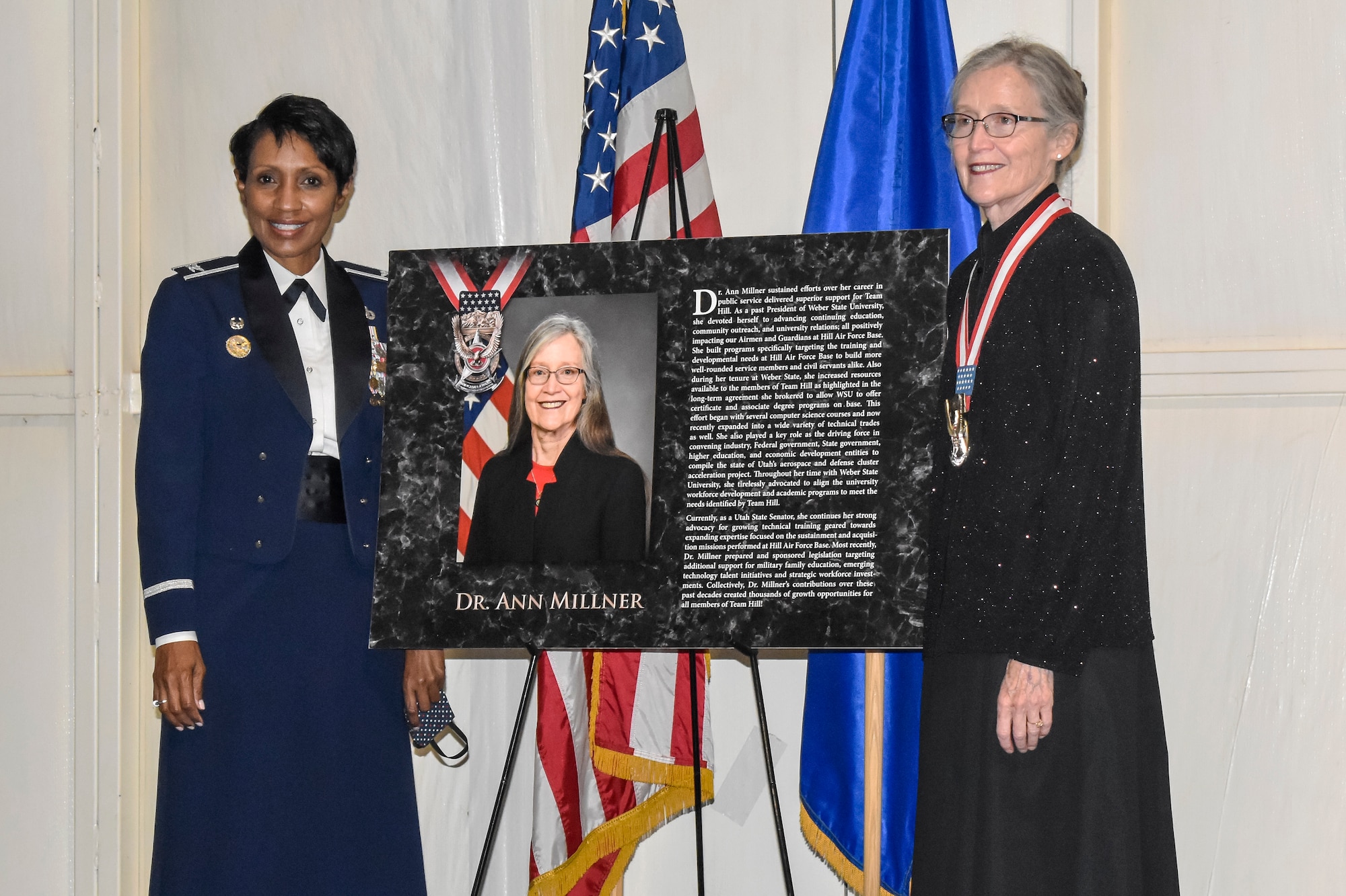 Col. Jenise Carroll, 75th Air Base Wing commander, poses with Dr. Ann Millner after receiving the prestigious Community Wingman Award at the Hill Aerospace Museum