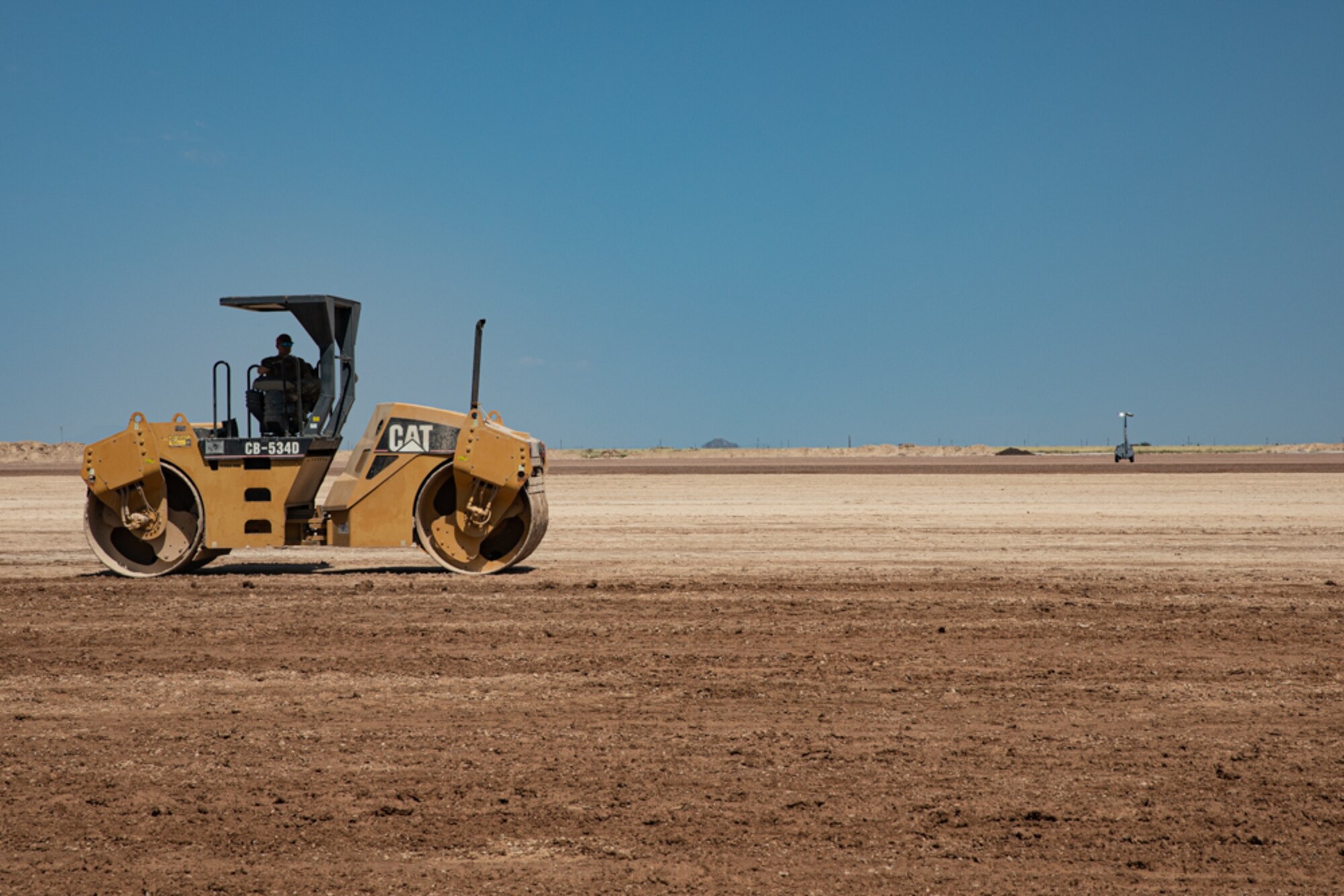 An Airman with Task Force-Holloman deployed from the 820th RED HORSE Squadron at Nellis Air Force Base, Nevada, clears an area of land for future construction as part of Operation Allies Welcome Sept. 16, 2021 on Holloman Air Force Base, New Mexico. The Department of Defense, through the U.S. Northern Command, and in support of the Department of State and Department of Homeland Security, is providing transportation, temporary housing, medical screening, and general support for at least 50,000 Afghan evacuees at suitable facilities, in permanent or temporary structures, as quickly as possible. This initiative provides Afghan evacuees essential support at secure locations outside Afghanistan. (U.S. Army photo by Spc. Nicholas Goodman)