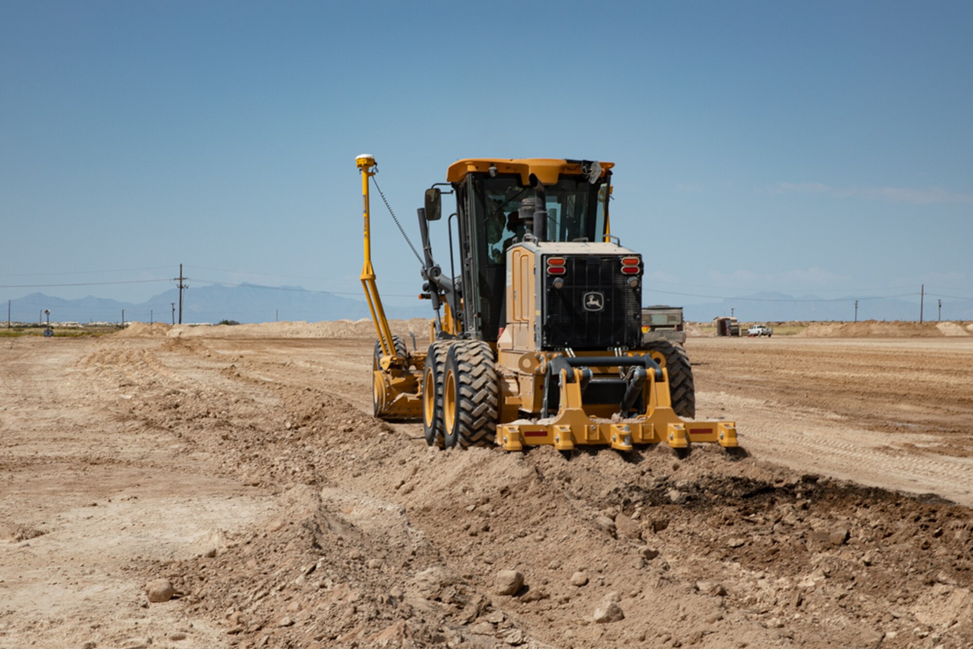 An Airman with Task Force-Holloman deployed from the 820th RED HORSE Squadron at Nellis Air Force Base, Nevada, clears an area of land for future construction as part of Operation Allies Welcome Sept. 16, 2021 on Holloman Air Force Base, New Mexico. The Department of Defense, through the U.S. Northern Command, and in support of the Department of State and Department of Homeland Security, is providing transportation, temporary housing, medical screening, and general support for at least 50,000 Afghan evacuees at suitable facilities, in permanent or temporary structures, as quickly as possible. This initiative provides Afghan evacuees essential support at secure locations outside Afghanistan. (U.S. Army photo by Spc. Nicholas Goodman)