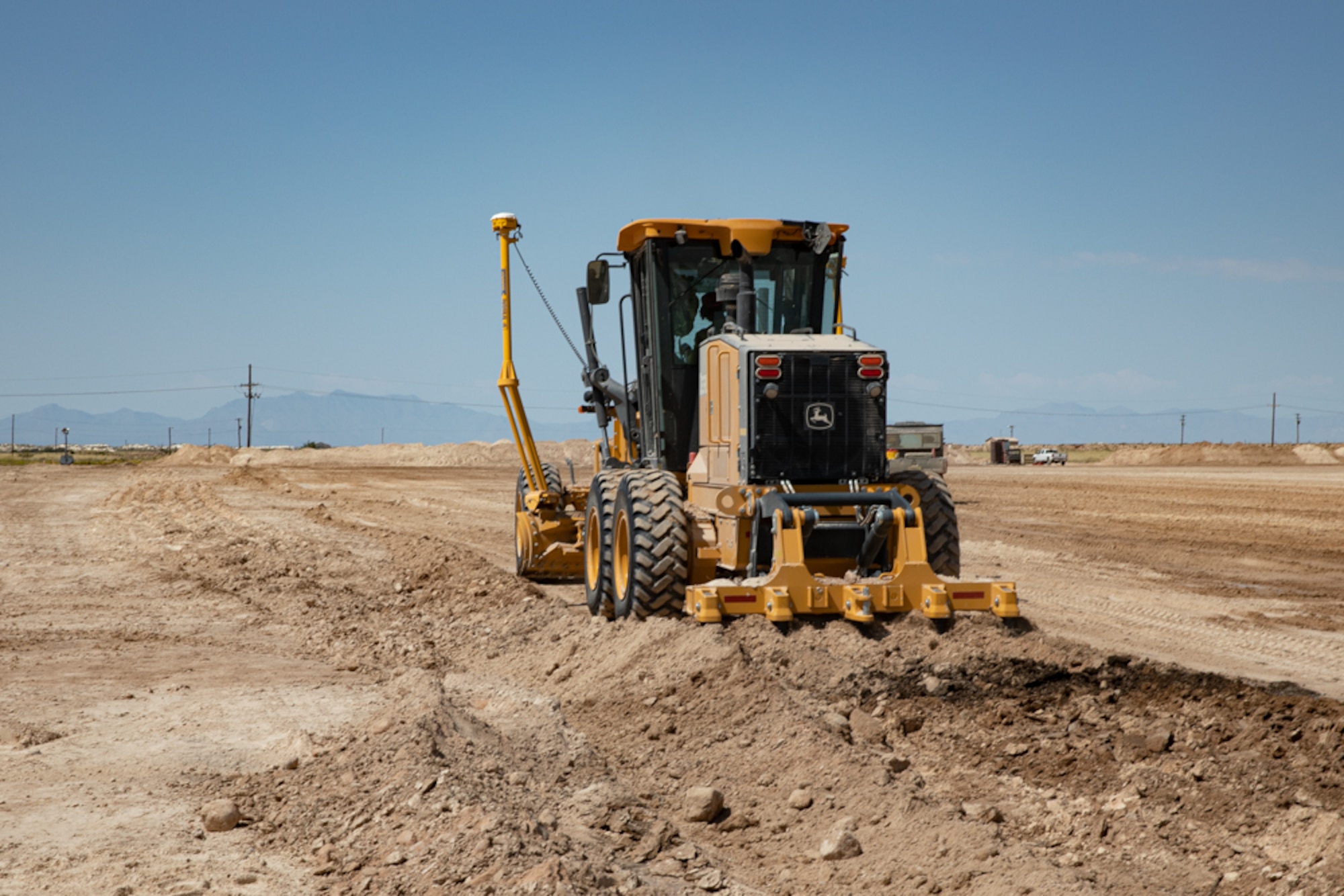 An Airman with Task Force-Holloman deployed from the 820th RED HORSE Squadron at Nellis Air Force Base, Nevada, clears an area of land for future construction as part of Operation Allies Welcome Sept. 16, 2021 on Holloman Air Force Base, New Mexico. The Department of Defense, through the U.S. Northern Command, and in support of the Department of State and Department of Homeland Security, is providing transportation, temporary housing, medical screening, and general support for at least 50,000 Afghan evacuees at suitable facilities, in permanent or temporary structures, as quickly as possible. This initiative provides Afghan evacuees essential support at secure locations outside Afghanistan. (U.S. Army photo by Spc. Nicholas Goodman)