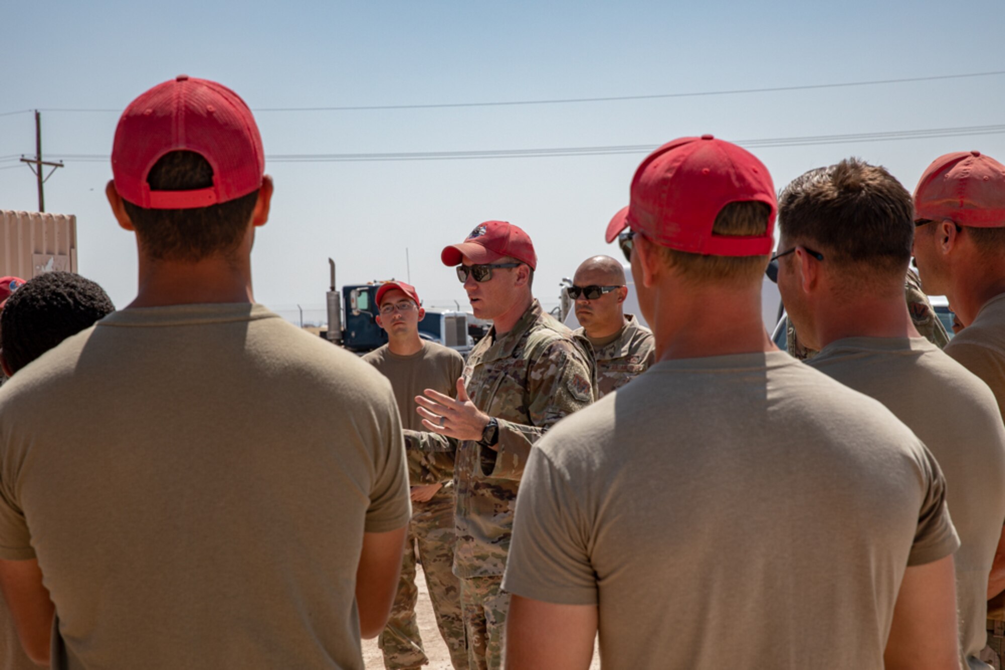 Airmen with Task Force-Holloman deployed from the 820th RED HORSE Squadron at Nellis Air Force Base, Nevada, discuss their plan of action for future construction as part of Operation Allies Welcome Sept. 16, 2021 on Holloman Air Force Base, New Mexico. The Department of Defense, through the U.S. Northern Command, and in support of the Department of State and Department of Homeland Security, is providing transportation, temporary housing, medical screening, and general support for at least 50,000 Afghan evacuees at suitable facilities, in permanent or temporary structures, as quickly as possible. This initiative provides Afghan evacuees essential support at secure locations outside Afghanistan. (U.S. Army photo by Spc. Nicholas Goodman)