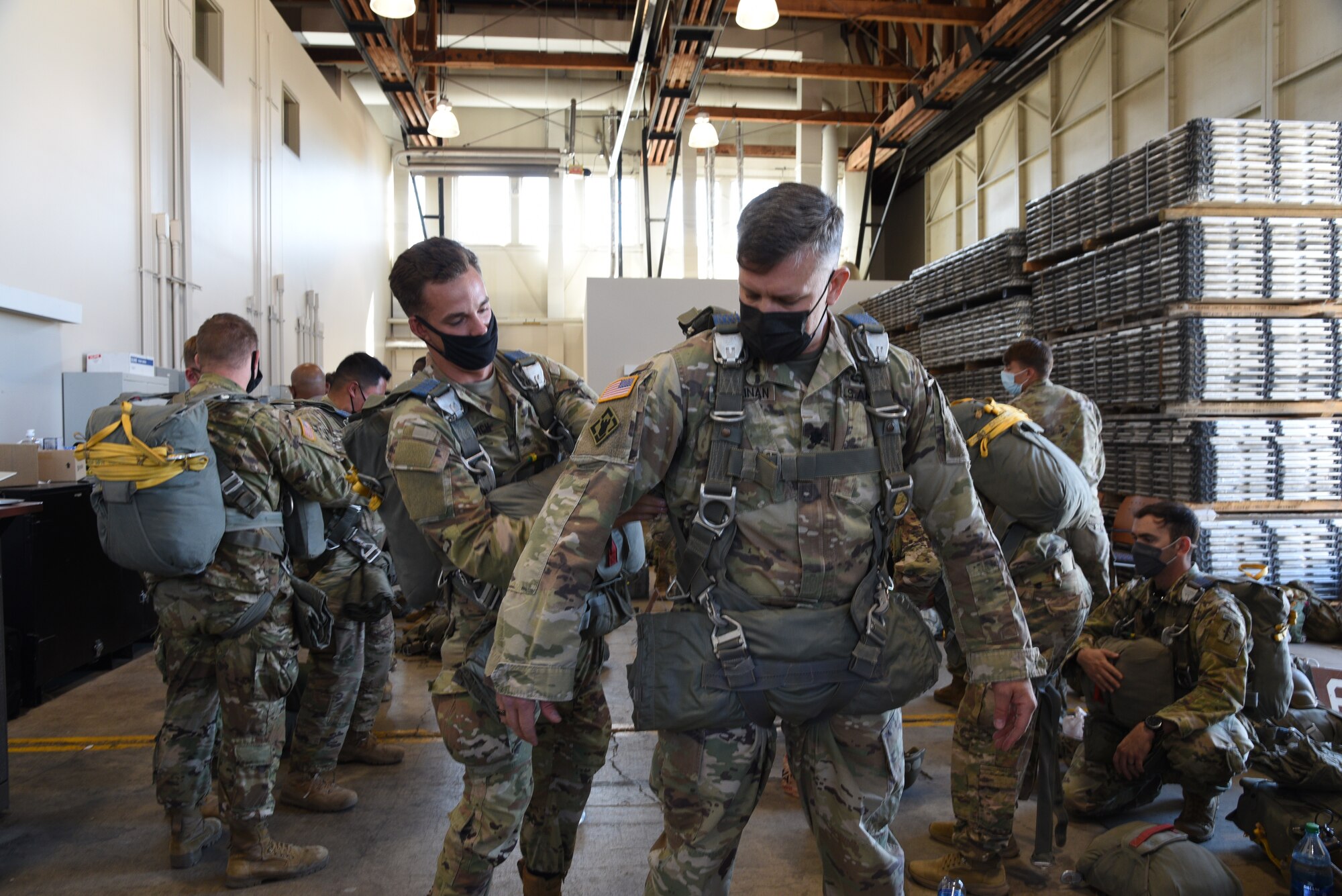 Lt. Col. Mike Hallinan, 10th Special Forces Group Airborne support battalion commander, gears up for his jump with assistance from Sgt. Geoffrey Espich, 10th SFG (A) transportation specialist, during the 22nd Air Force’s flagship exercise Rally in the Rockies Sept. 13-17, 2021. The exercise is designed to develop Airmen for combat operations by challenging them with realistic scenarios that support a full spectrum of operations during military actions, operations or hostile environments. (U.S. Air Force photo by Master Sgt. Jessica Kendziorek)