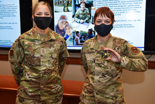 U.S. Air Force Chief Master Sgt. Rebecca Arbona, 17th Training Wing command chief, and Staff Sgt. Seraiah Wolf, 17th Civil Engineer Squadron Airman dorm leader pose for a photo on Goodfellow Air Force Base, Texas, Sept. 21, 2021. Wolf was coined for her role in ensuring permanent party dorm residents have everything they need while living on base. (U.S. Air Force photo by Senior Airman Jermaine Ayers)