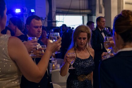 Airmen and their families present a silent toast, during the Air Force Ball aboard the USS YORKTOWN at Patriot’s Point, Mount Pleasant, South Carolina, Sept. 17, 2021. Attendees present a silent toast in honor of America’s POW/MIA and to the success of the efforts to account for them.